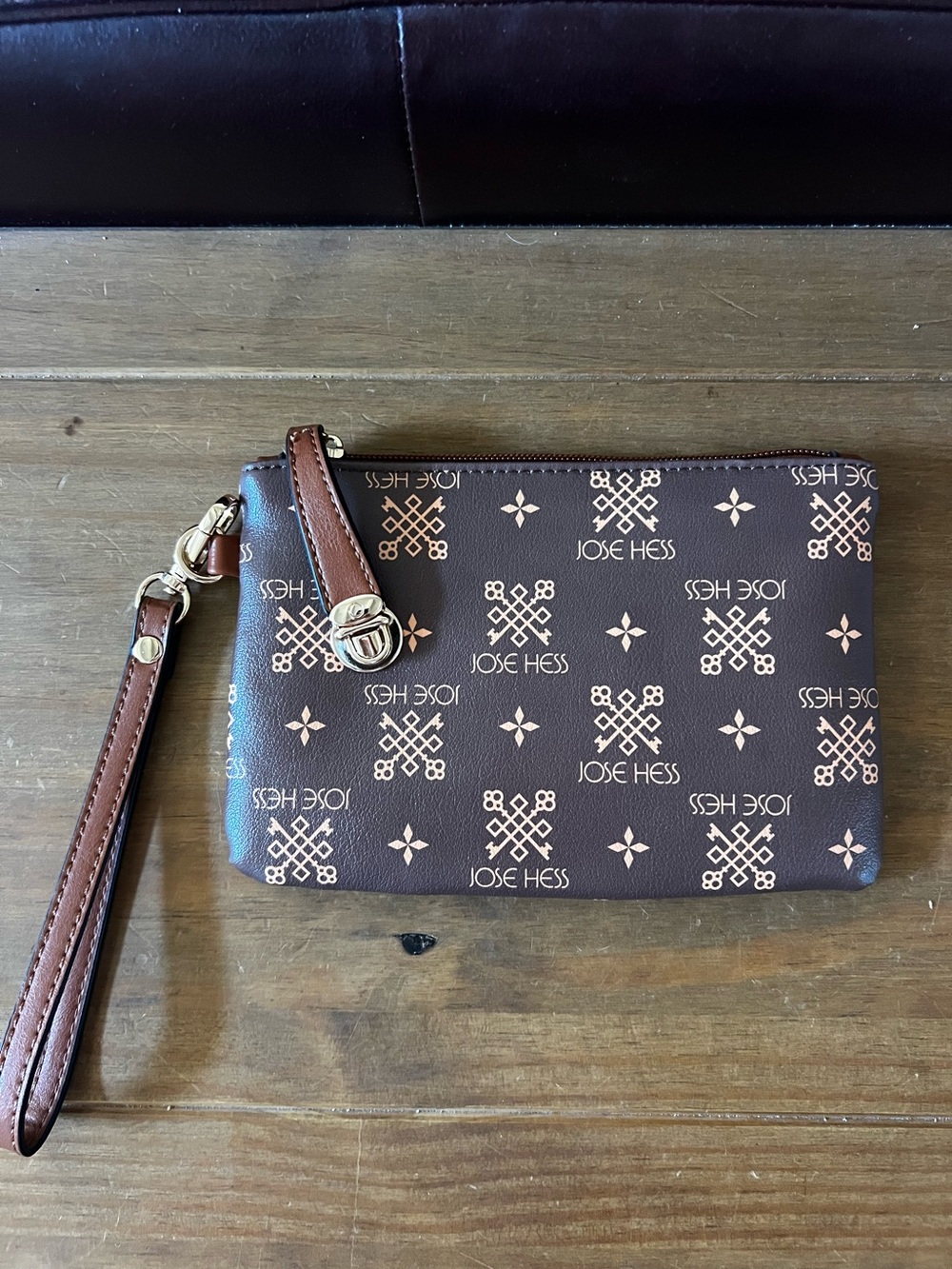 Jose Hess wristlet new and unused. Measures 8”x5.5” vegan leather.